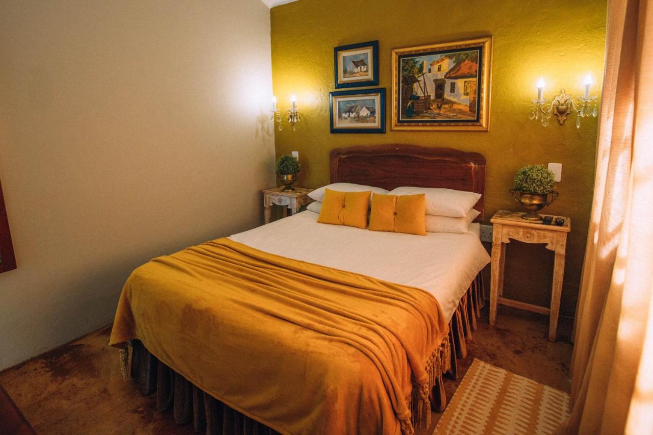 Room 1 double bed with gold feature wall